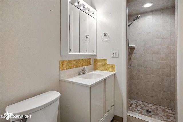 3337 Madison Way, Anchorage, AK 99508 - full bathroom featuring a shower stall, vanity, recessed lighting, and tasteful backsplash