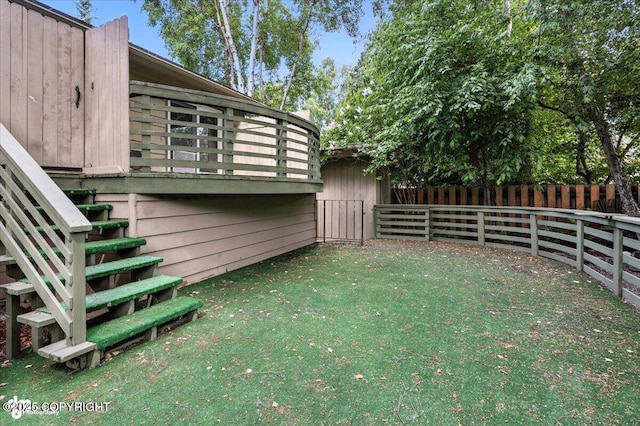 3337 Madison Way, Anchorage, AK 99508 - fenced backyard with stairway and a deck