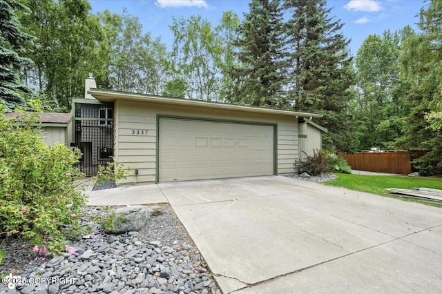 3337 Madison Way, Anchorage, AK 99508 - garage with concrete driveway