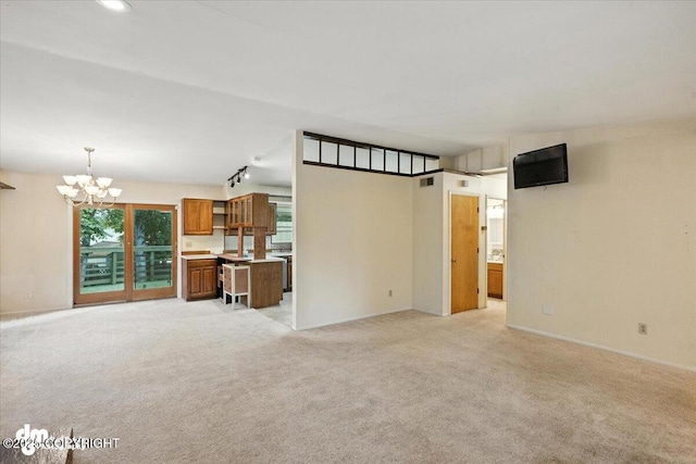 3337 Madison Way, Anchorage, AK 99508 - unfurnished living room featuring a chandelier and light colored carpet