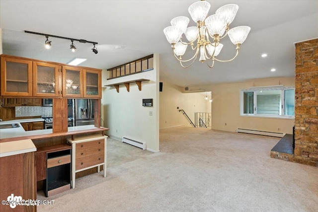 3337 Madison Way, Anchorage, AK 99508 - kitchen featuring brown cabinets, a baseboard heating unit, stainless steel appliances, a baseboard radiator, and rail lighting