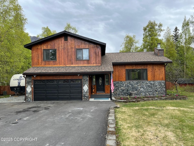21675 Sheltering Spruce Loop, Chugiak, AK 99567 - view of front of property featuring stone siding, an attached garage, a chimney, driveway, and a shingled roof