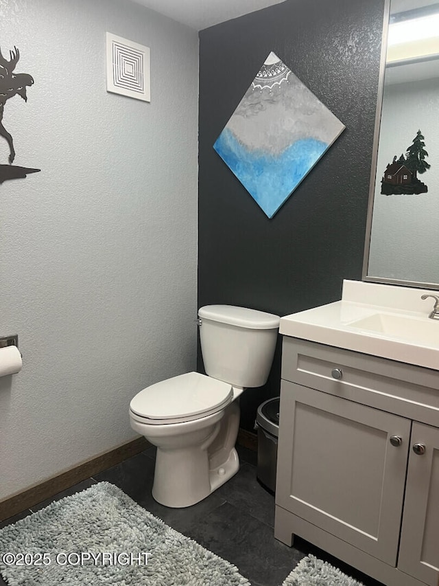 21675 Sheltering Spruce Loop, Chugiak, AK 99567 - half bath with toilet, vanity, and tile patterned flooring
