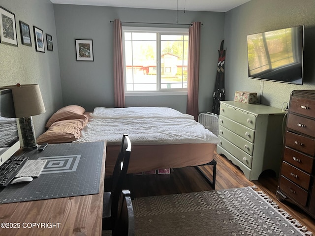 21675 Sheltering Spruce Loop, Chugiak, AK 99567 - bedroom featuring wood finished floors