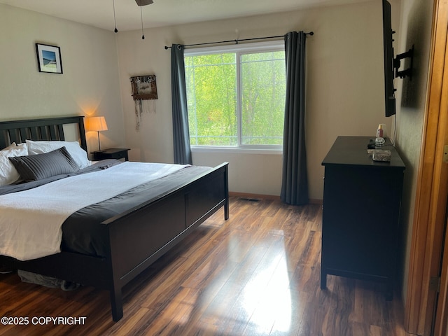 21675 Sheltering Spruce Loop, Chugiak, AK 99567 - bedroom featuring wood finished floors and baseboards