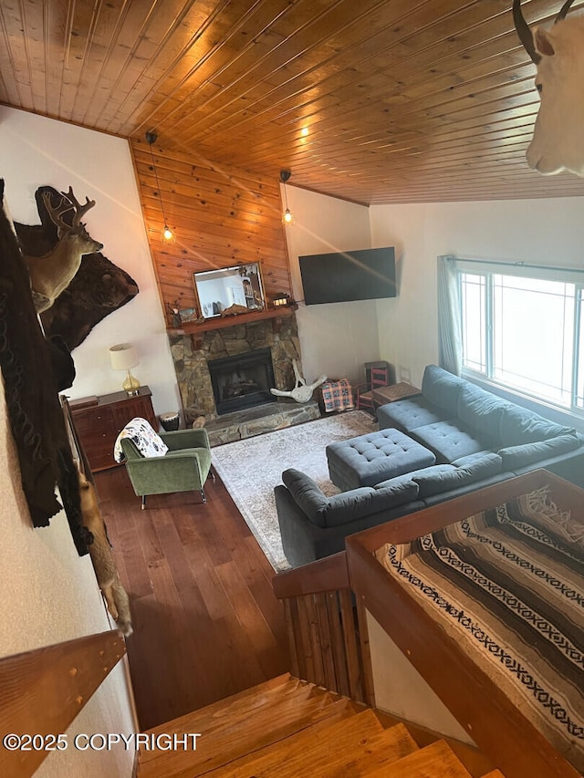 21675 Sheltering Spruce Loop, Chugiak, AK 99567 - living area featuring wood-type flooring, wood ceiling, a fireplace, and wooden walls