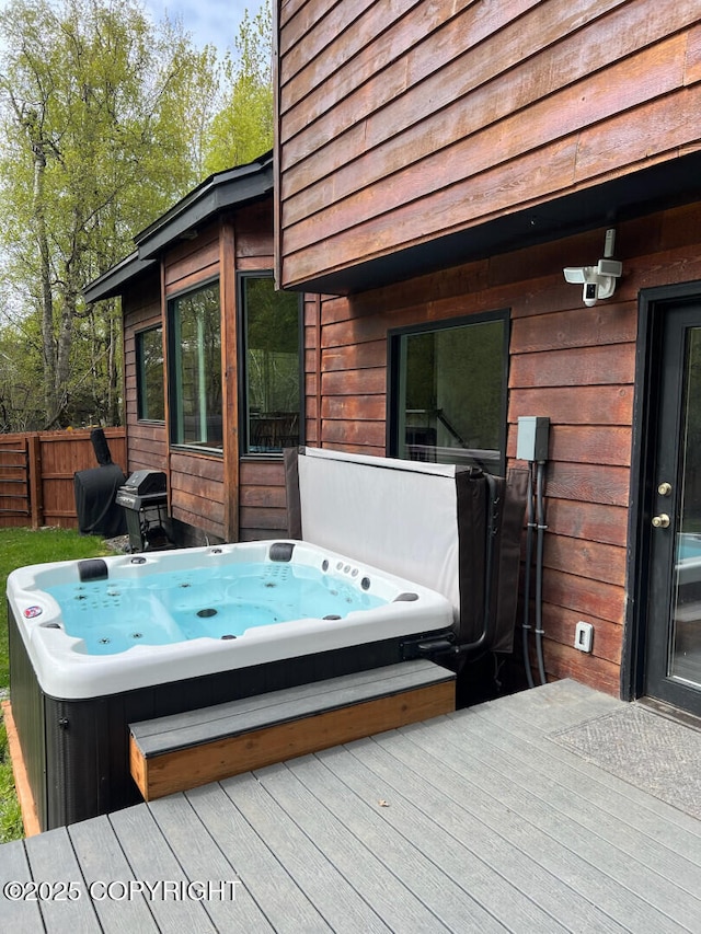 21675 Sheltering Spruce Loop, Chugiak, AK 99567 - wooden deck with a covered hot tub, fence, and a grill