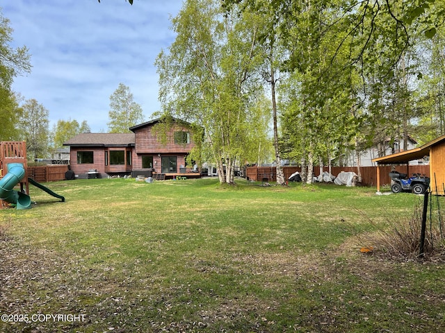 21675 Sheltering Spruce Loop, Chugiak, AK 99567 - view of yard with a playground