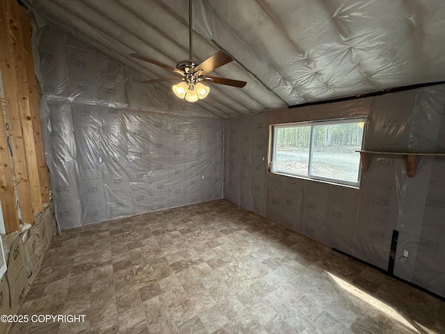 26155 W Long Lake Rd, Willow, AK 99688 - unfurnished room featuring vaulted ceiling and a ceiling fan