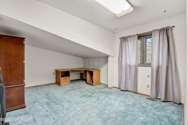 unfurnished office featuring carpet and baseboards