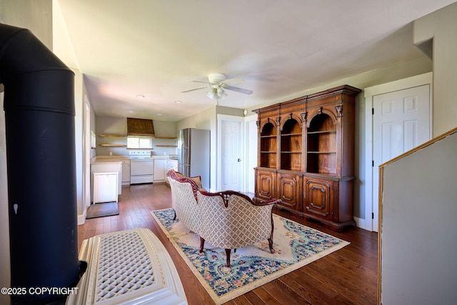 3625 W Hill Rd, Homer, AK 99603 - living room with ceiling fan, dark wood finished floors, and baseboards