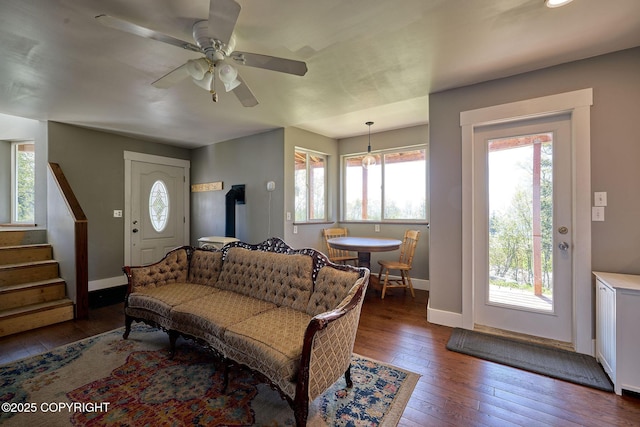 3625 W Hill Rd, Homer, AK 99603 - living area with dark wood-style flooring, baseboards, a ceiling fan, and stairs