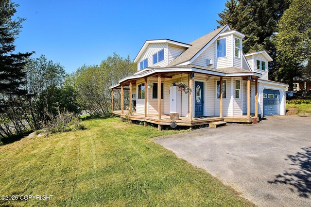 3625 W Hill Rd, Homer, AK 99603 - view of front of property featuring covered porch, a garage, a front lawn, asphalt driveway, and roof with shingles