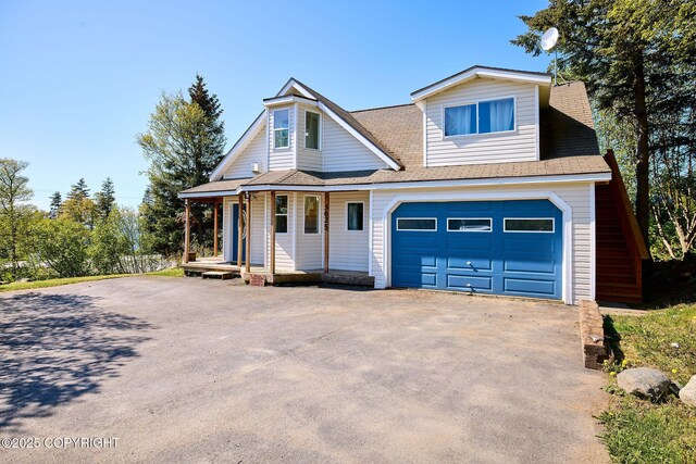 3625 W Hill Rd, Homer, AK 99603 - view of front of home featuring driveway, covered porch, an attached garage, and a shingled roof