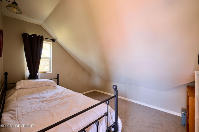 3625 W Hill Rd, Homer, AK 99603 - carpeted bedroom featuring vaulted ceiling and baseboards