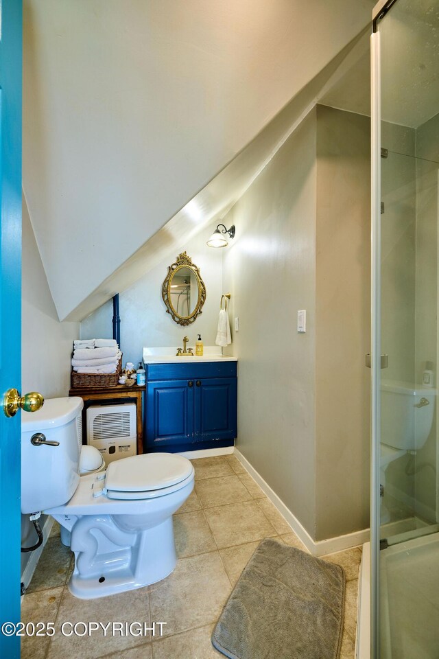 3625 W Hill Rd, Homer, AK 99603 - bathroom with toilet, a shower stall, vanity, and tile patterned flooring