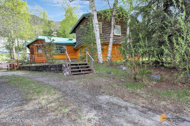 20811 Eagle River Rd, Eagle River, AK 99577 - view of front facade with metal roof