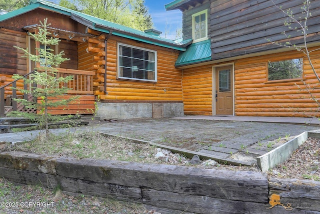 20811 Eagle River Rd, Eagle River, AK 99577 - exterior space with metal roof and log siding