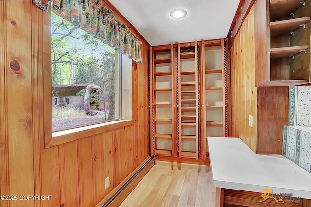 20811 Eagle River Rd, Eagle River, AK 99577 - spacious closet with light wood-style floors and a baseboard heating unit
