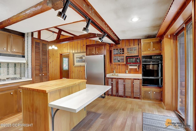 20811 Eagle River Rd, Eagle River, AK 99577 - kitchen featuring black oven, a warming drawer, wooden counters, light wood-style floors, and white gas stovetop
