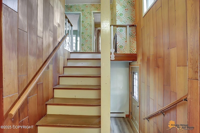 20811 Eagle River Rd, Eagle River, AK 99577 - staircase with a baseboard radiator, plenty of natural light, wallpapered walls, and wood finished floors