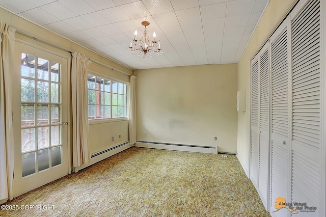 20811 Eagle River Rd, Eagle River, AK 99577 - unfurnished bedroom featuring a baseboard heating unit, a chandelier, carpet, and a closet