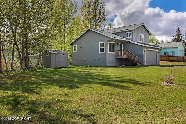 rear view of property featuring a storage unit, a garage, an outdoor structure, and driveway