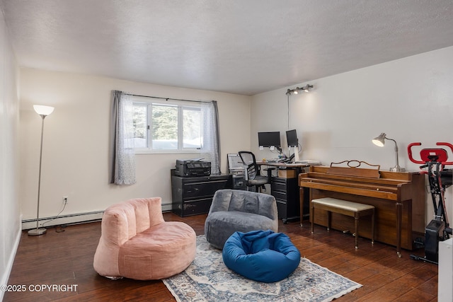 living area with a baseboard radiator, wood-type flooring, and a desk