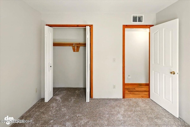 36115 Mackey Lake Rd, Soldotna, AK 99669 - unfurnished bedroom featuring carpet flooring and a closet