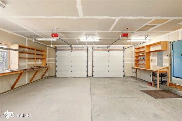 36115 Mackey Lake Rd, Soldotna, AK 99669 - garage featuring electric panel and a garage door opener