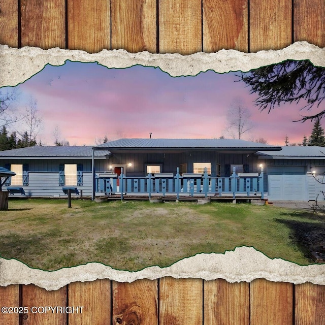 36115 Mackey Lake Rd, Soldotna, AK 99669 - view of front facade featuring board and batten siding, a wooden deck, a front yard, and a garage