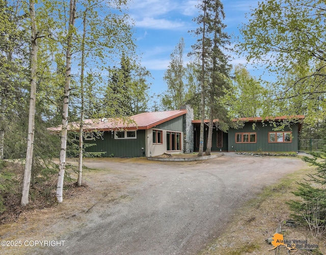 7956 Seclusion Dr, Anchorage, AK 99504 - mid-century home featuring driveway and metal roof