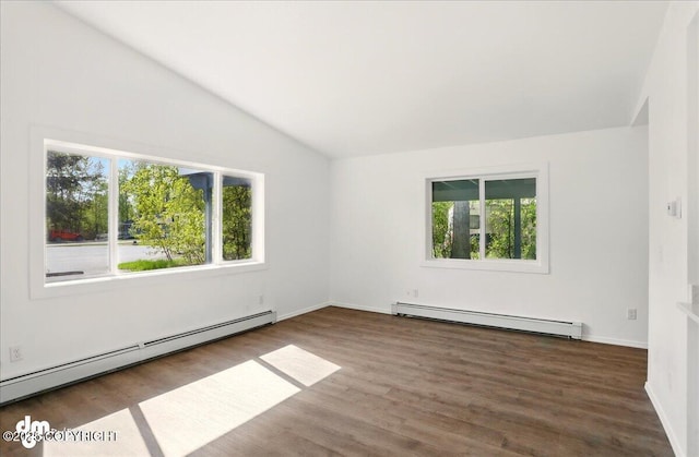 961 E Dellwood St, Wasilla, AK 99654 - spare room with a baseboard heating unit, lofted ceiling, wood finished floors, and baseboards