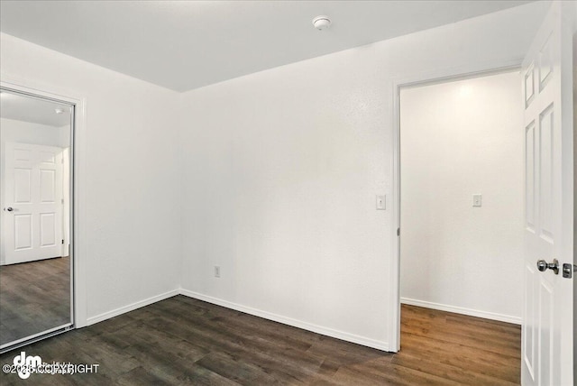 961 E Dellwood St, Wasilla, AK 99654 - unfurnished room featuring dark wood finished floors, a smoke detector, and baseboards