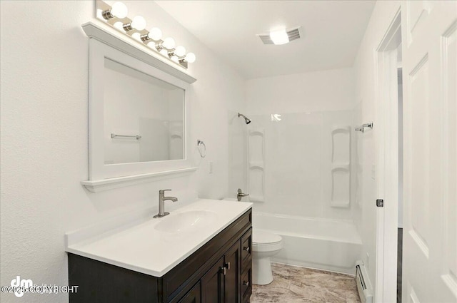 961 E Dellwood St, Wasilla, AK 99654 - full bathroom with a baseboard radiator, vanity, toilet, and bathing tub / shower combination