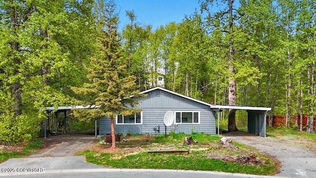 961 E Dellwood St, Wasilla, AK 99654 - view of front of house with driveway and a carport