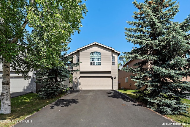 1957 Terrebonne Loop, Anchorage, AK 99502 - traditional home with asphalt driveway and an attached garage