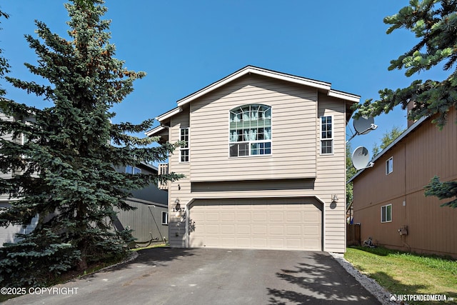 1957 Terrebonne Loop, Anchorage, AK 99502 - view of front of property featuring a garage and asphalt driveway