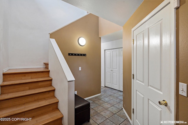 1957 Terrebonne Loop, Anchorage, AK 99502 - staircase featuring baseboards and vaulted ceiling