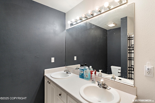 1957 Terrebonne Loop, Anchorage, AK 99502 - full bathroom featuring a textured wall and double vanity