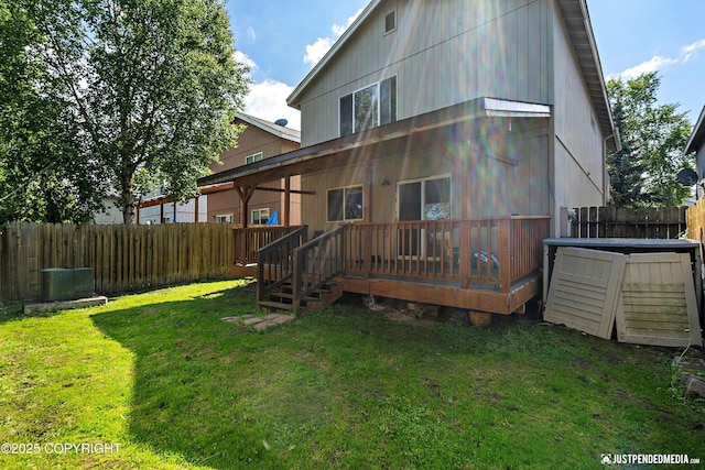 1957 Terrebonne Loop, Anchorage, AK 99502 - back of house with a fenced backyard and a deck