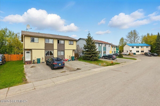 multi unit property with uncovered parking and a residential view