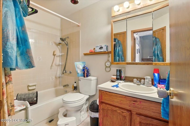 full bathroom featuring vanity, bathtub / shower combination, and toilet