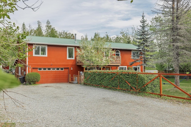 1061 E Agate Ln, Wasilla, AK 99654 - view of front of property featuring driveway, an attached garage, and metal roof