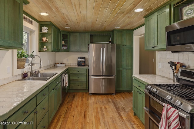 1061 E Agate Ln, Wasilla, AK 99654 - kitchen featuring green cabinets, appliances with stainless steel finishes, tile countertops, wood ceiling, and recessed lighting
