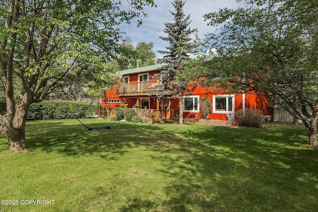 1061 E Agate Ln, Wasilla, AK 99654 - back of house with a lawn, a balcony, and a deck