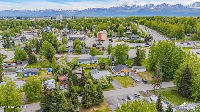 4313 Lois Dr, Anchorage, AK 99517 - aerial view of property's location with a mountainous background and nearby suburban area