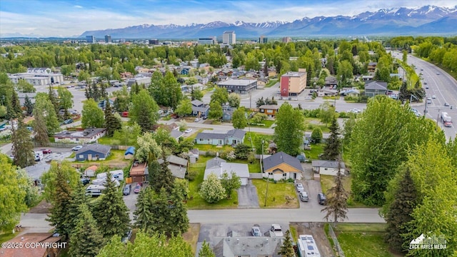 4313 Lois Dr, Anchorage, AK 99517 - aerial view of property and surrounding area with a mountain backdrop and nearby suburban area