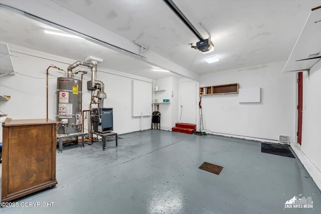 4313 Lois Dr, Anchorage, AK 99517 - garage featuring secured water heater and a garage door opener