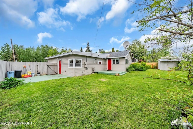 4313 Lois Dr, Anchorage, AK 99517 - rear view of property with a gate, a deck, and a patio area